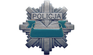 Odznaka policyjna koloru szarego z napisem Policja